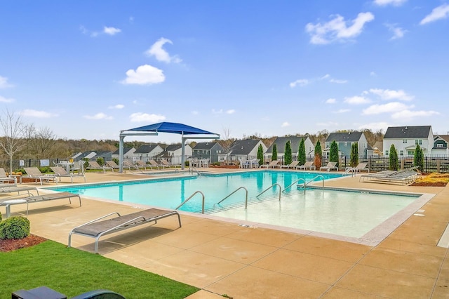 view of swimming pool with a patio area