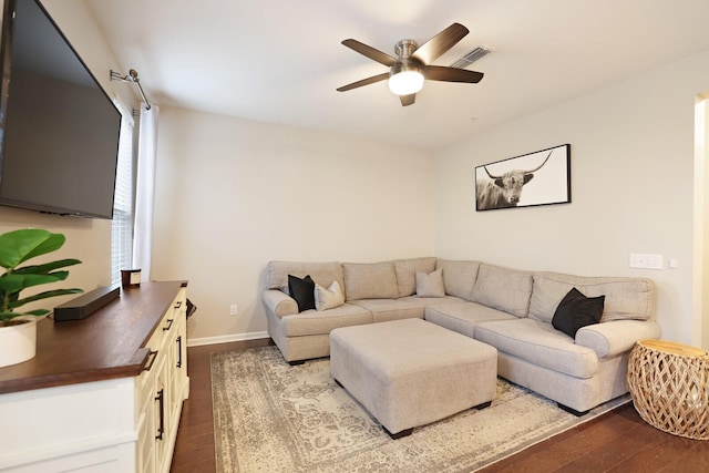 living room featuring ceiling fan and wood-type flooring