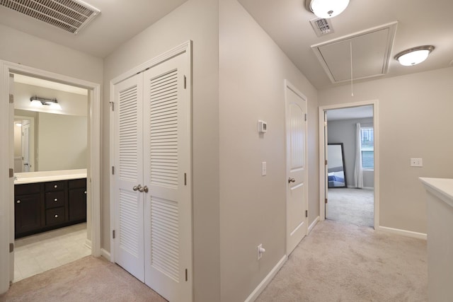 hallway with light carpet