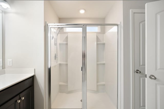 bathroom featuring vanity and walk in shower