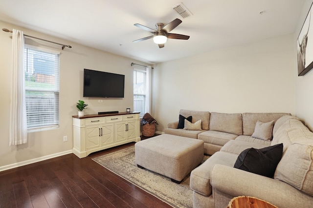 living room with ceiling fan, plenty of natural light, and dark hardwood / wood-style floors