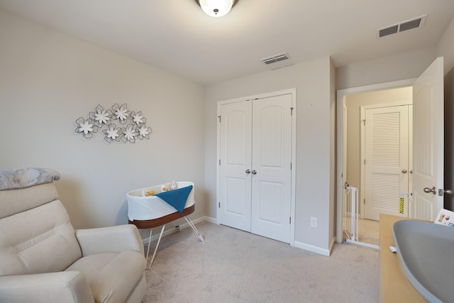 sitting room featuring light colored carpet and sink