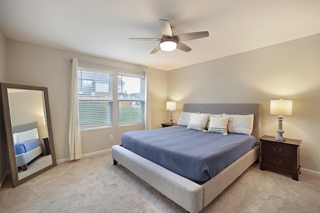 bedroom featuring ceiling fan and light carpet