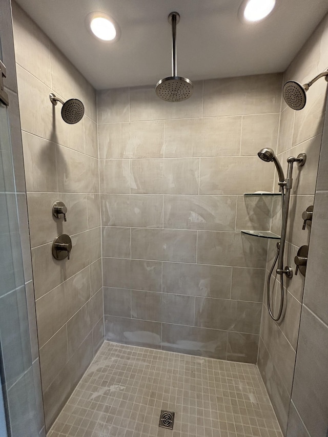 bathroom with tiled shower