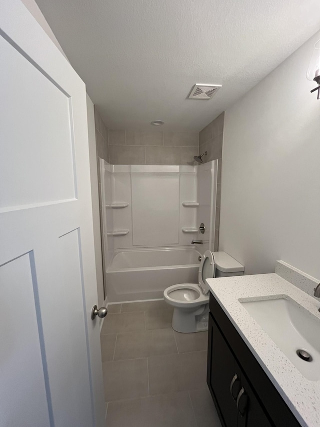 full bath featuring visible vents, toilet, a textured ceiling, shower / tub combination, and vanity