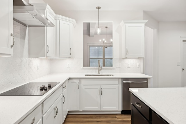 kitchen with light countertops, dishwasher, white cabinetry, a sink, and black electric stovetop