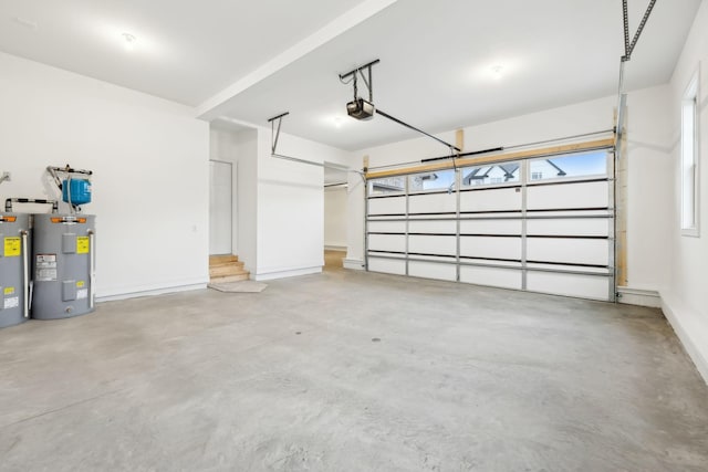 garage with electric water heater and a garage door opener