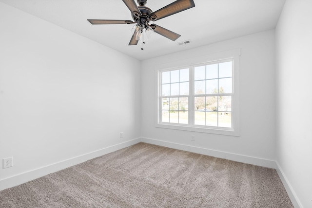 spare room with carpet flooring and ceiling fan