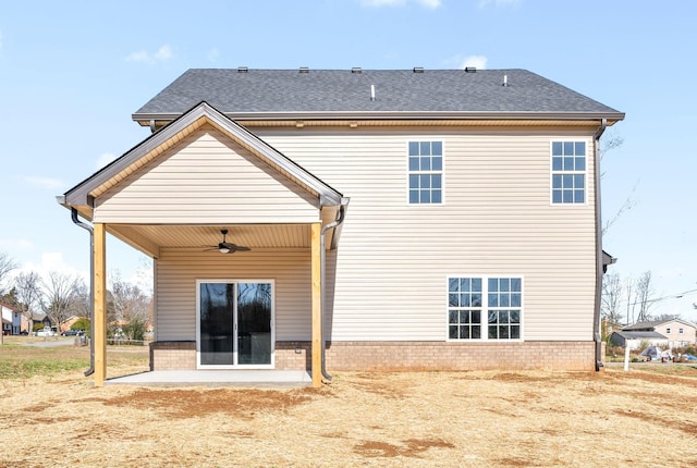 rear view of house featuring ceiling fan and a patio area