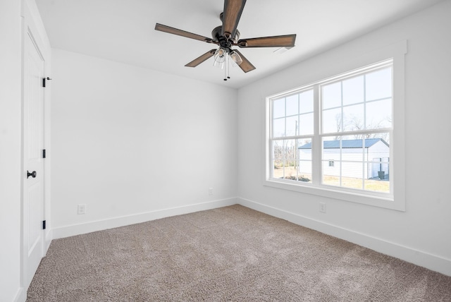 empty room with carpet floors and ceiling fan