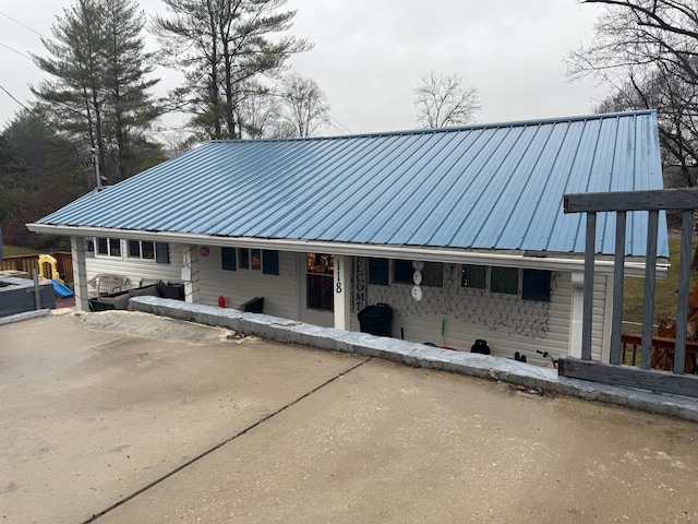 exterior space with metal roof