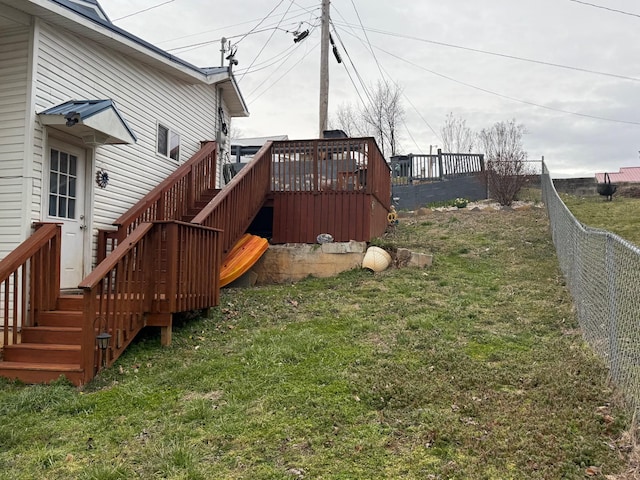 view of yard with a fenced backyard, stairway, and a deck