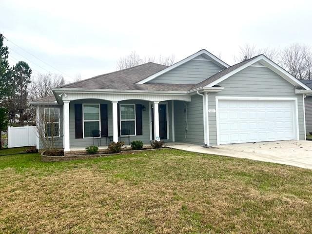 view of front facade featuring a front yard and a garage