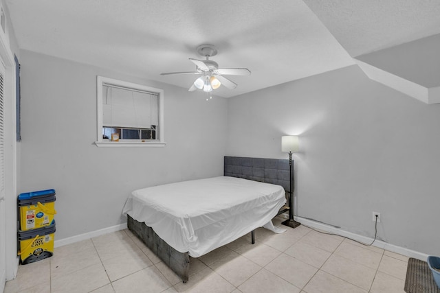 tiled bedroom featuring a textured ceiling, ceiling fan, and billiards