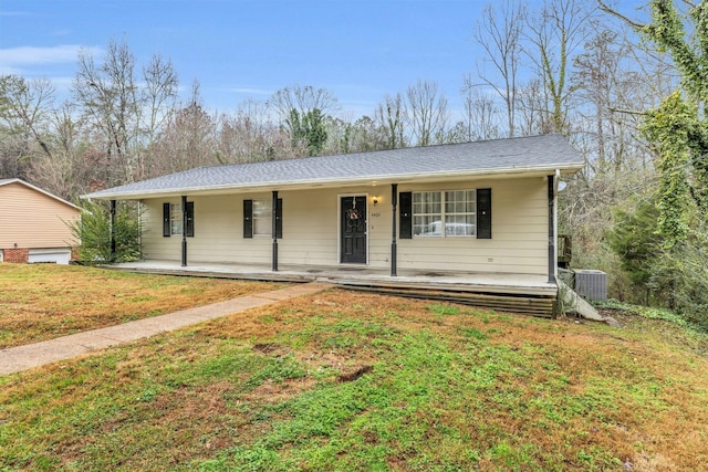 ranch-style home with covered porch, a front lawn, and cooling unit