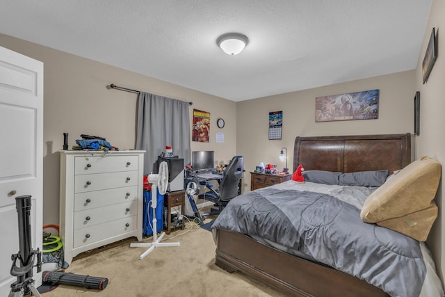 bedroom with light carpet and a textured ceiling