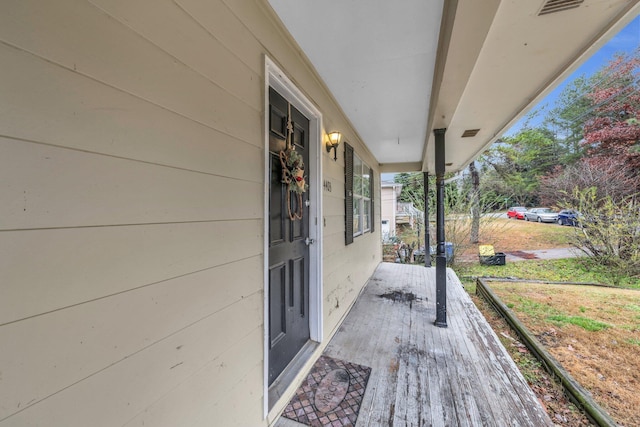 wooden terrace featuring a porch