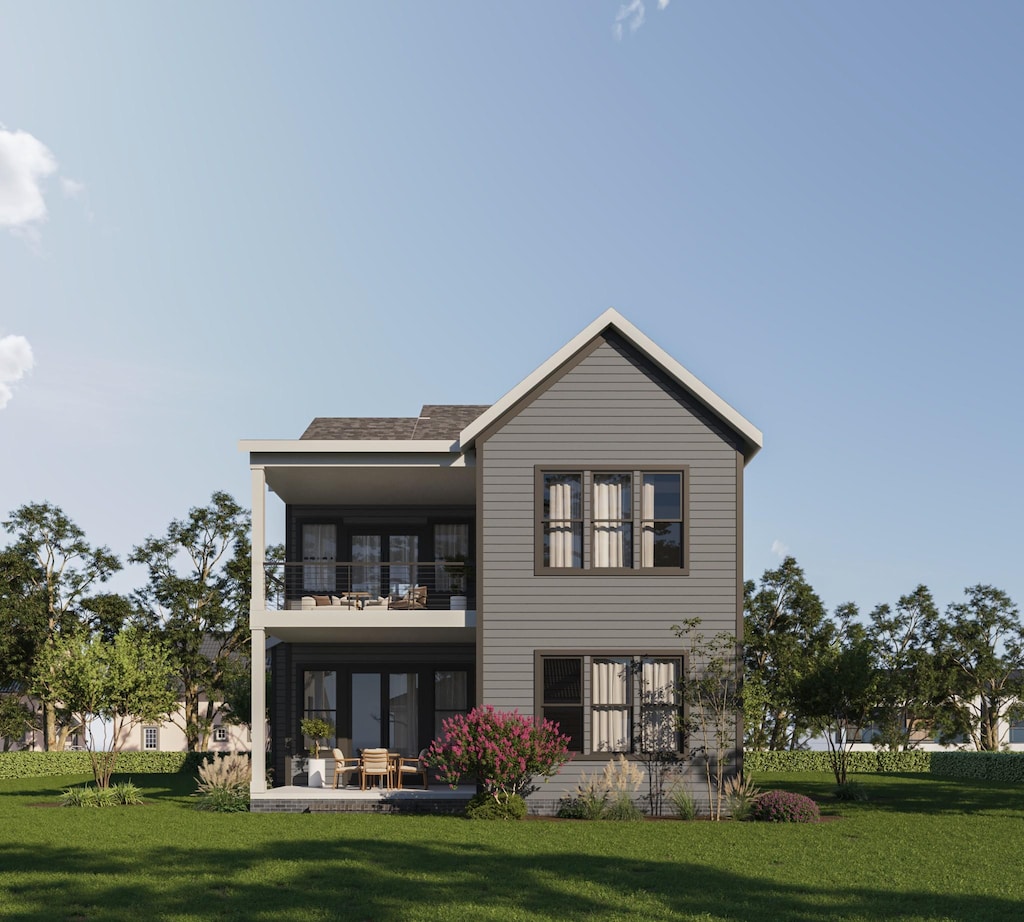 back of house with a balcony, a yard, and a patio