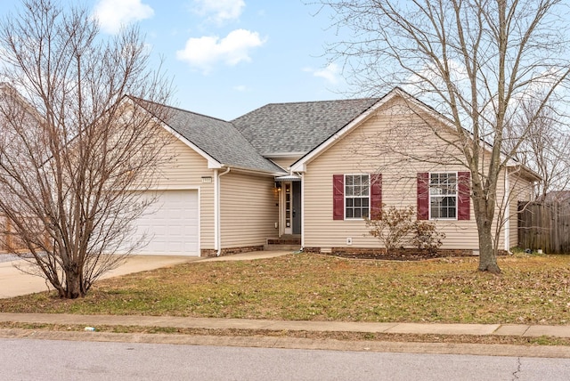 view of front of property with a garage and a front lawn