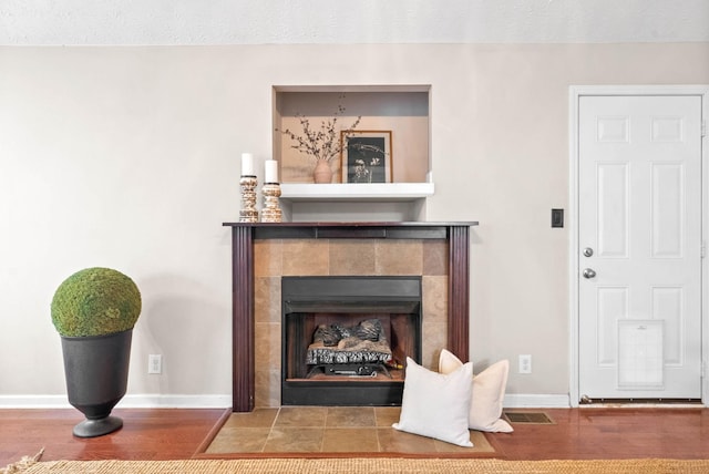 room details featuring wood-type flooring and a fireplace