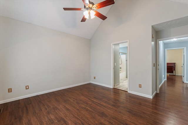 unfurnished bedroom featuring dark hardwood / wood-style flooring, ensuite bath, high vaulted ceiling, and ceiling fan