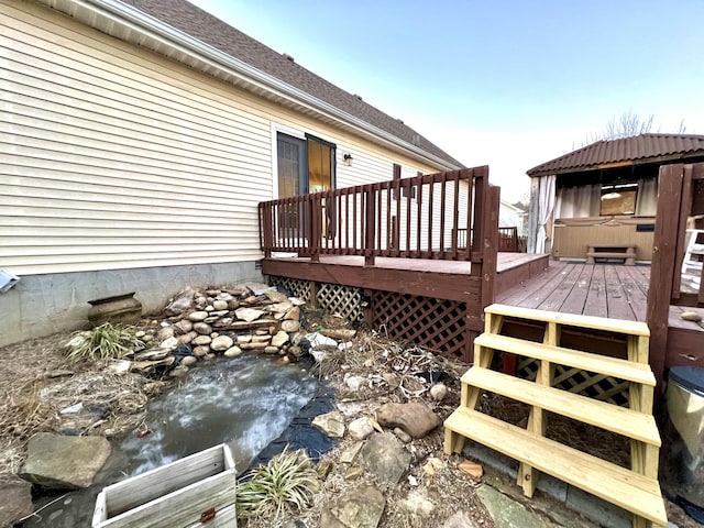 deck with a hot tub