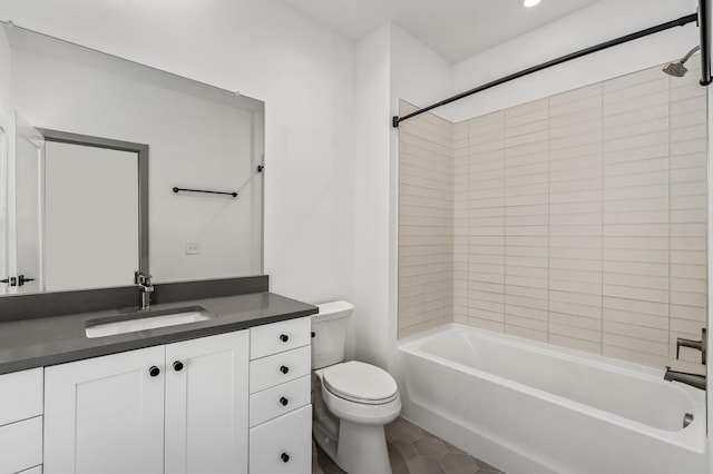 full bathroom featuring vanity, tiled shower / bath combo, toilet, and tile patterned flooring