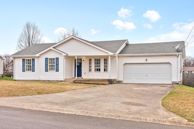 single story home featuring a front lawn and a garage