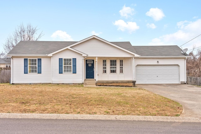 ranch-style home featuring a garage and a front lawn