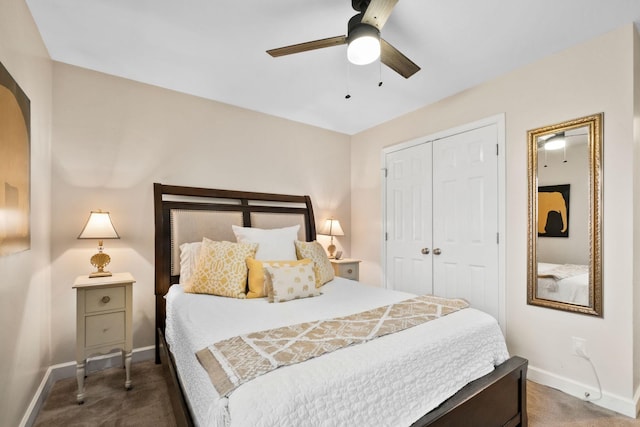 bedroom featuring ceiling fan, a closet, and dark colored carpet