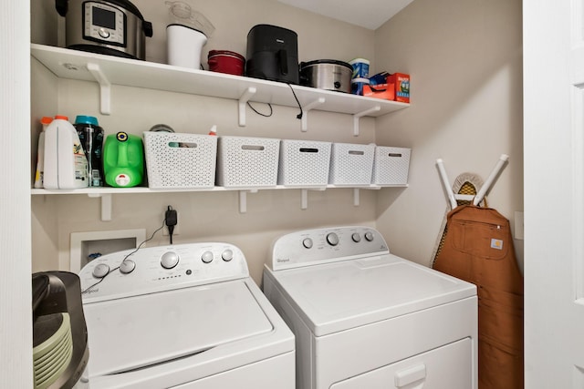 clothes washing area featuring independent washer and dryer