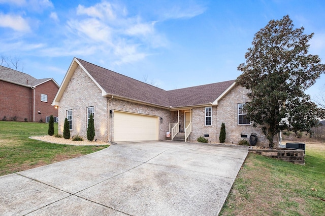 ranch-style house featuring a garage and a front yard