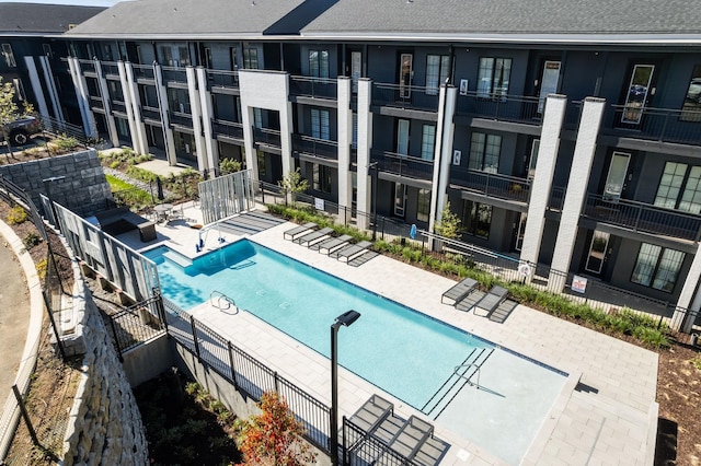 view of swimming pool featuring a patio area