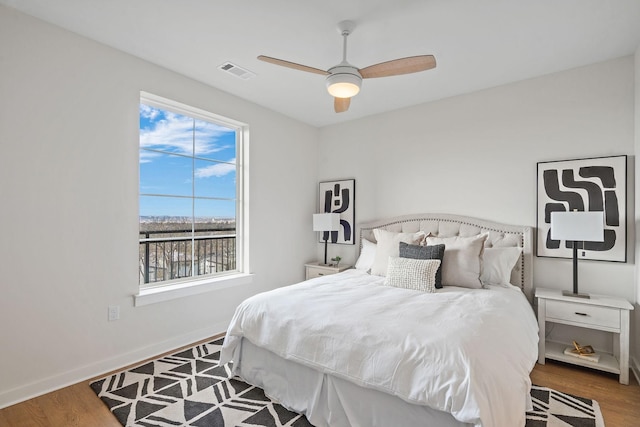 bedroom featuring hardwood / wood-style floors and ceiling fan