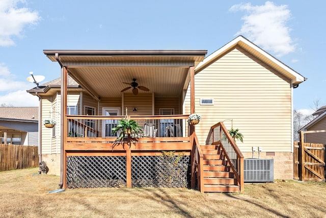 rear view of house with central AC, ceiling fan, and a wooden deck