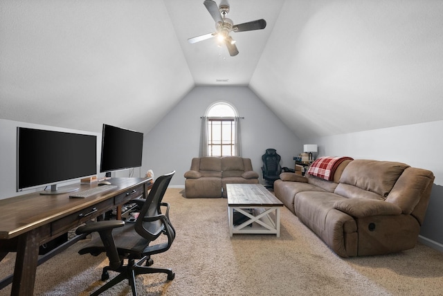 office featuring ceiling fan, carpet, and lofted ceiling