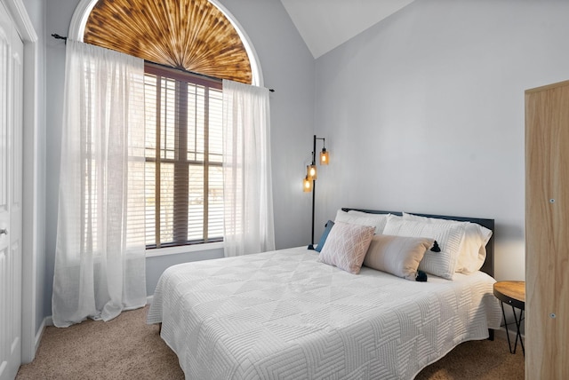 carpeted bedroom with vaulted ceiling