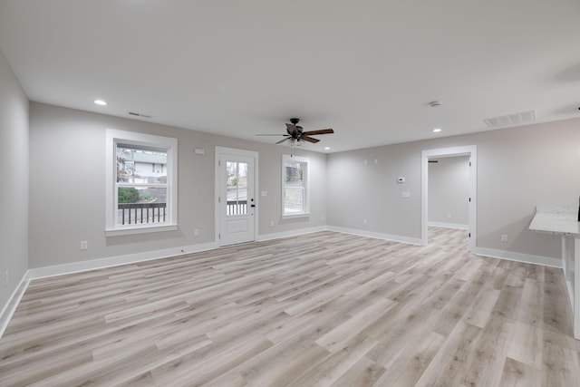 unfurnished living room featuring light hardwood / wood-style floors and ceiling fan