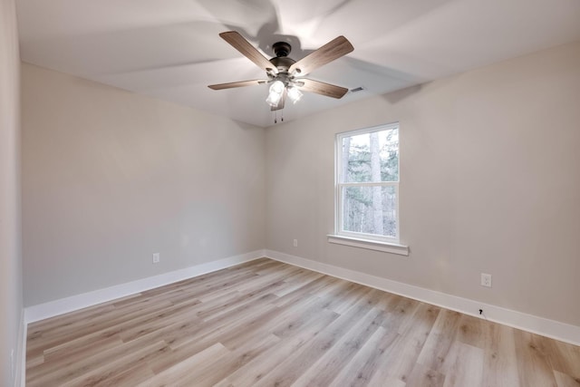 empty room featuring ceiling fan and light wood-type flooring