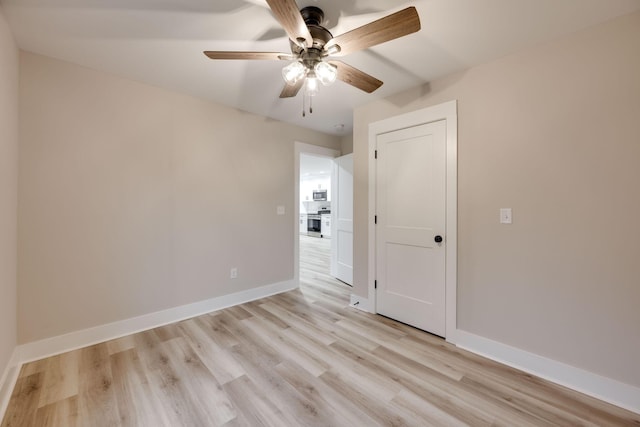 unfurnished bedroom featuring ceiling fan and light hardwood / wood-style flooring