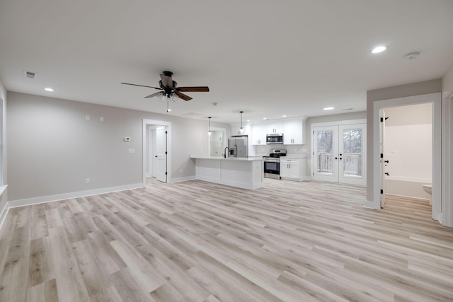 unfurnished living room with french doors, light hardwood / wood-style flooring, and ceiling fan