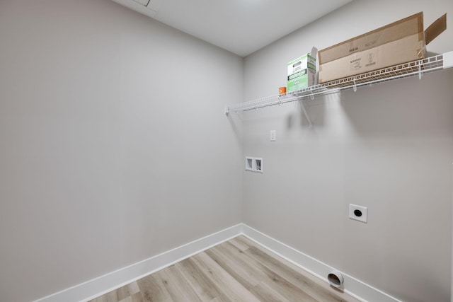 clothes washing area featuring washer hookup, light wood-type flooring, and hookup for an electric dryer