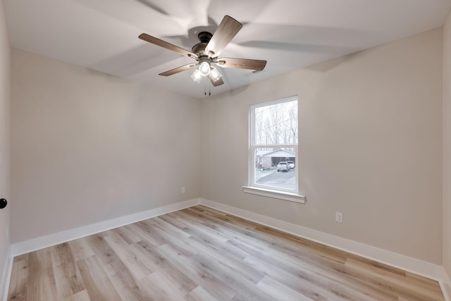 empty room with ceiling fan and light wood-type flooring