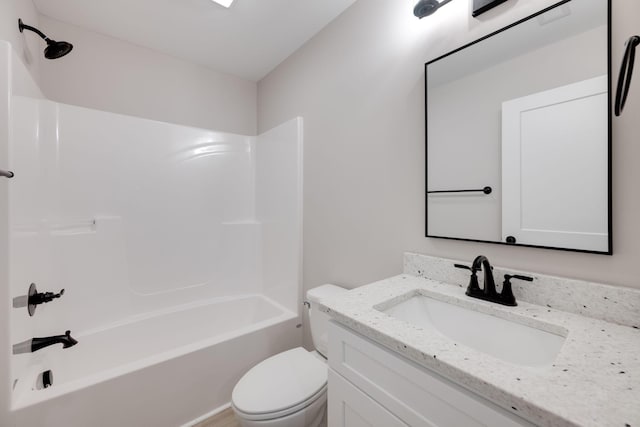 full bathroom with vanity, toilet, and washtub / shower combination