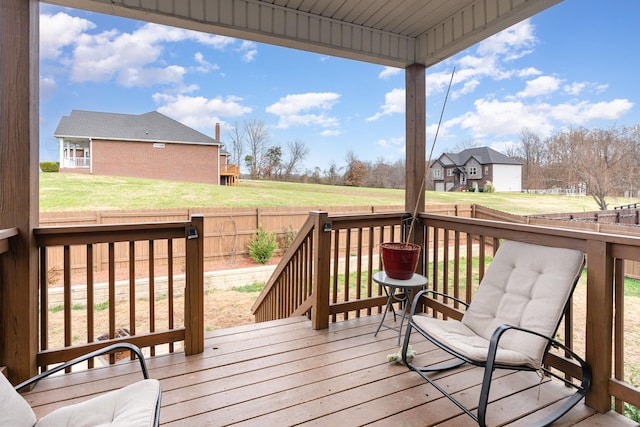 wooden deck with a yard