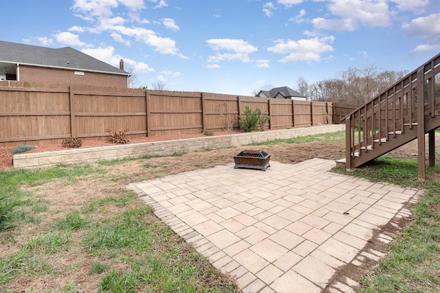 view of patio / terrace featuring an outdoor fire pit