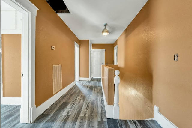 hallway featuring dark wood-type flooring