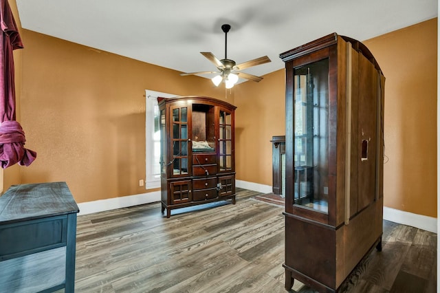 sitting room featuring ceiling fan and hardwood / wood-style flooring