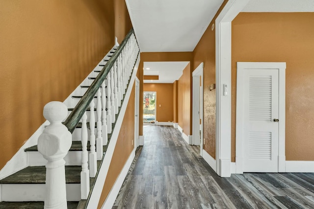 stairway featuring hardwood / wood-style floors