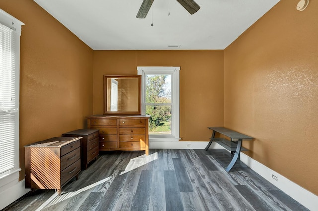 misc room with dark hardwood / wood-style floors and ceiling fan